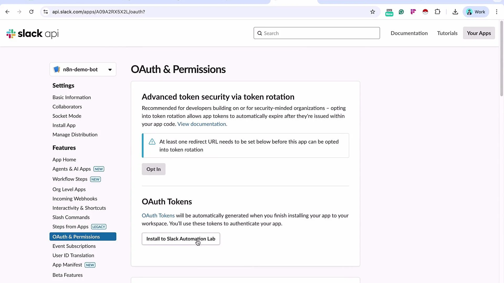 The image shows the Slack API page focused on OAuth & Permissions, featuring options for token rotation and OAuth token generation, along with navigation links on the left side for various settings and features.
