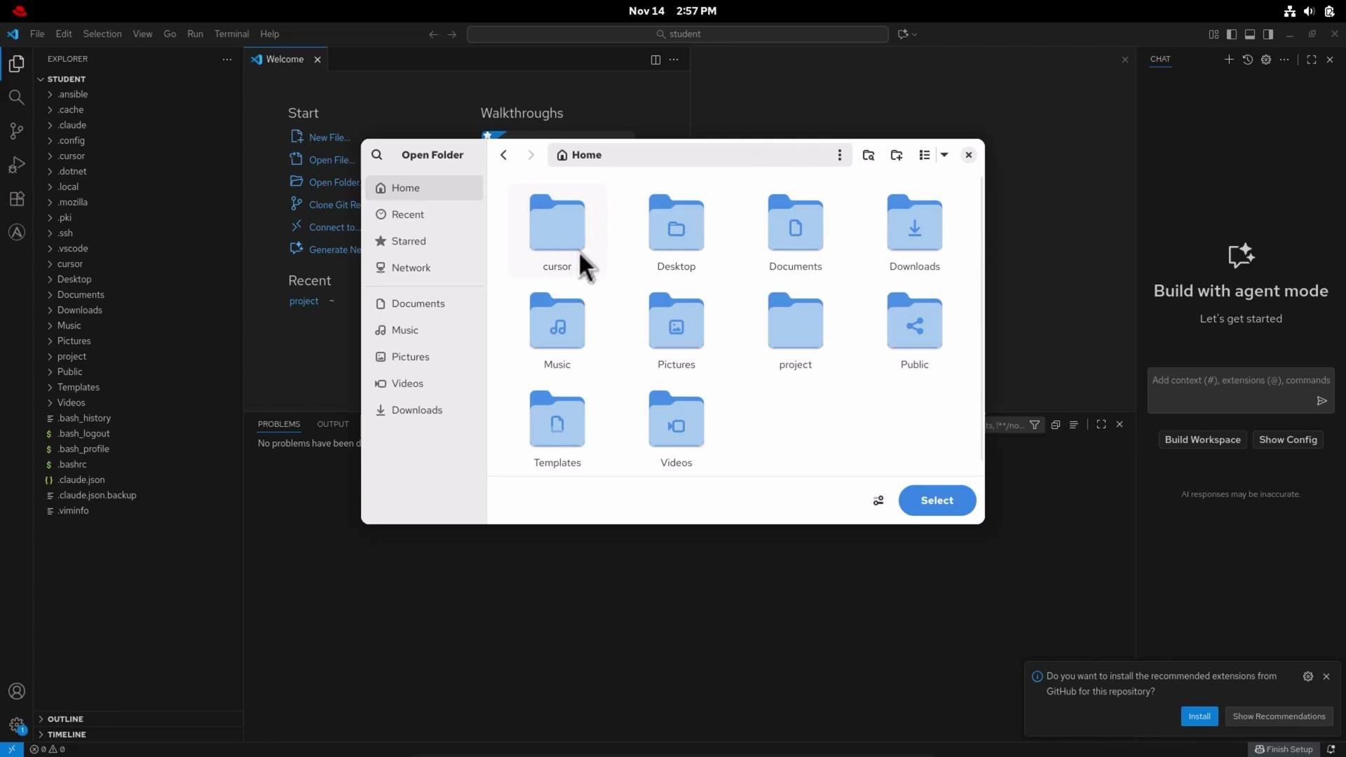 A screenshot of a dark-themed code editor (Visual Studio Code) with an open file picker window showing a Home folder and blue folder icons like Desktop, Documents, Downloads, Music, Pictures, and Videos. The code editor sidebar and a "Build with agent mode" panel are visible in the background.