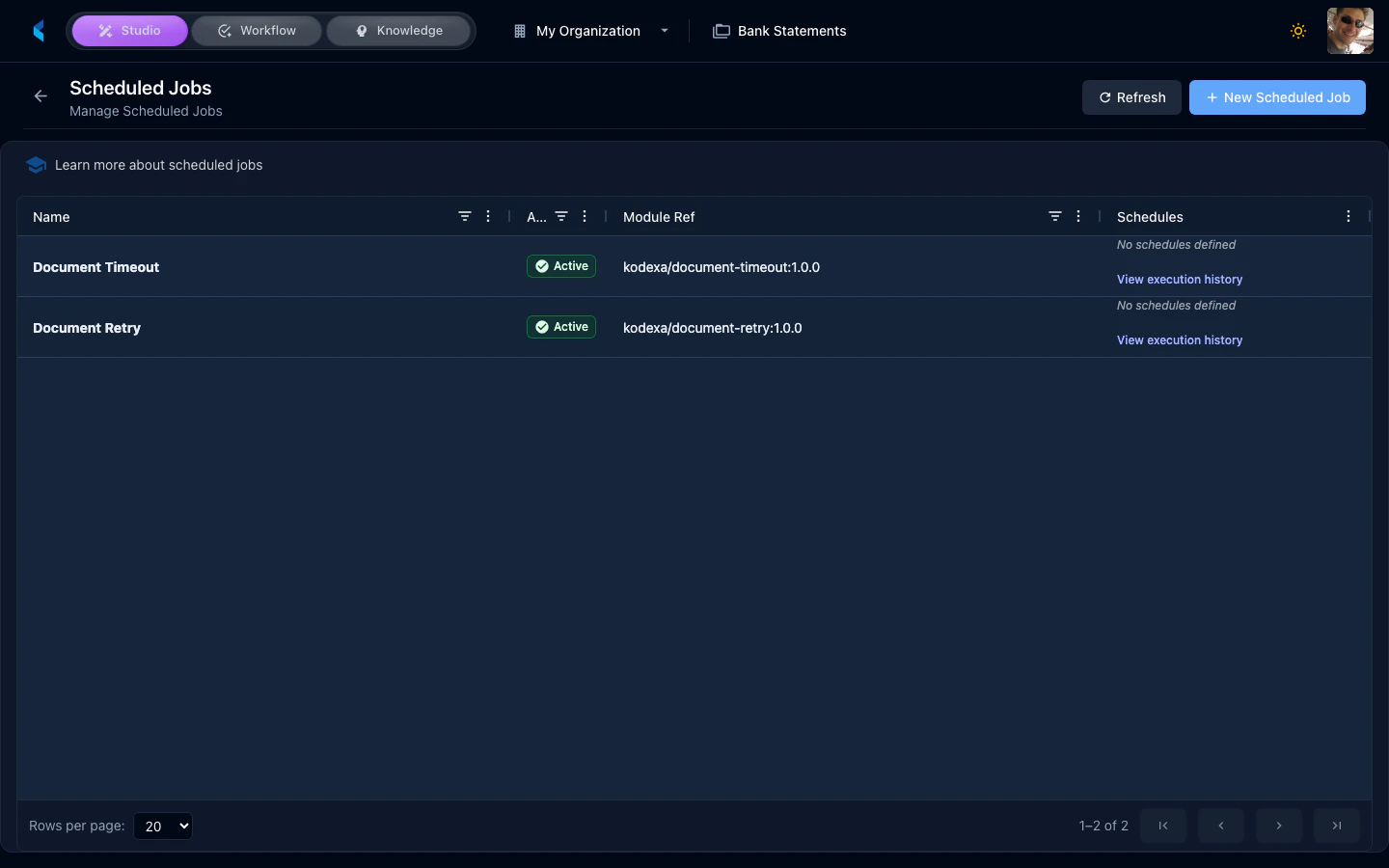 Scheduled Jobs page showing list of configured jobs with names, schedules, and status