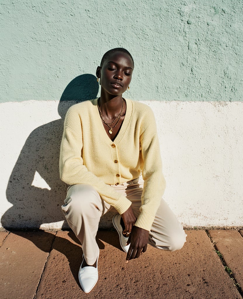 A Full Length Fashion Photograph Of A Tall Lean Black Woman With A Shaved Head Crouching Low Agains Eix1ydasnntuixwxcfqa 1
