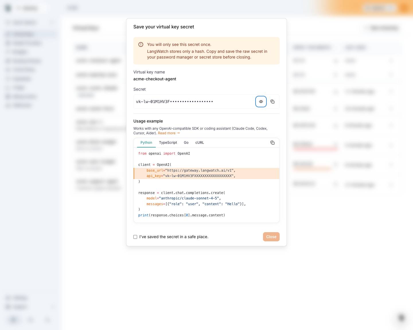 The Save your virtual key secret dialog with the masked secret and a Python usage example