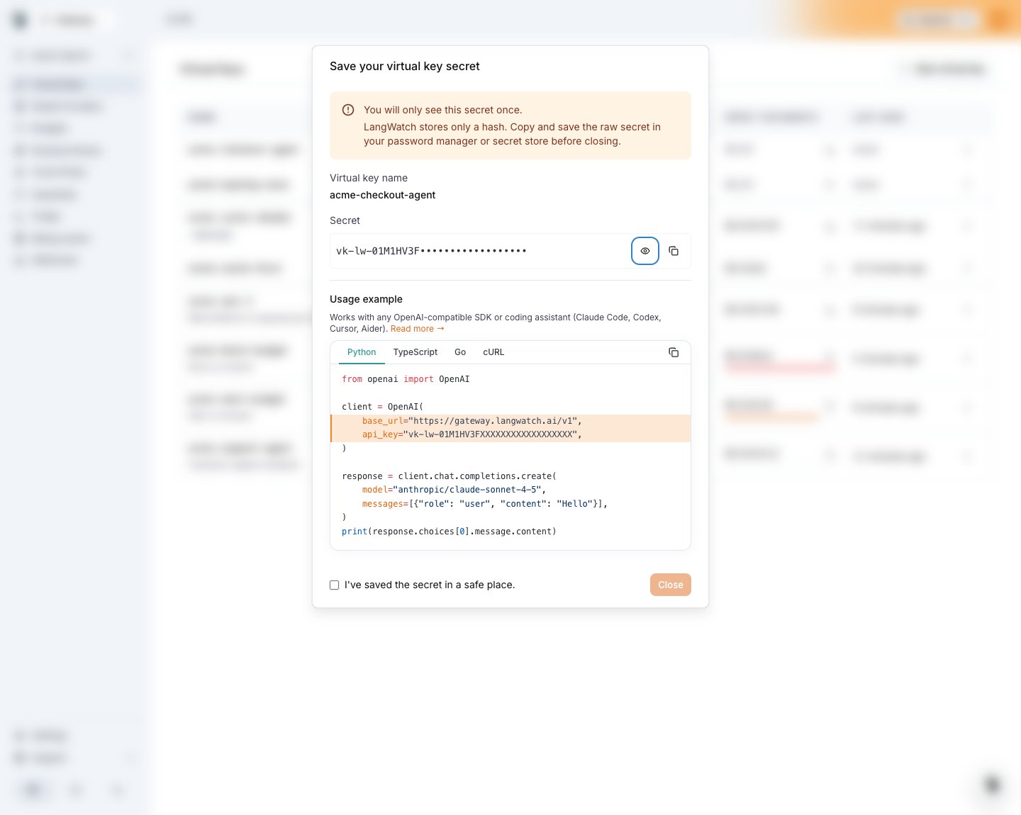 The Save your virtual key secret dialog with the masked secret and a Python usage example