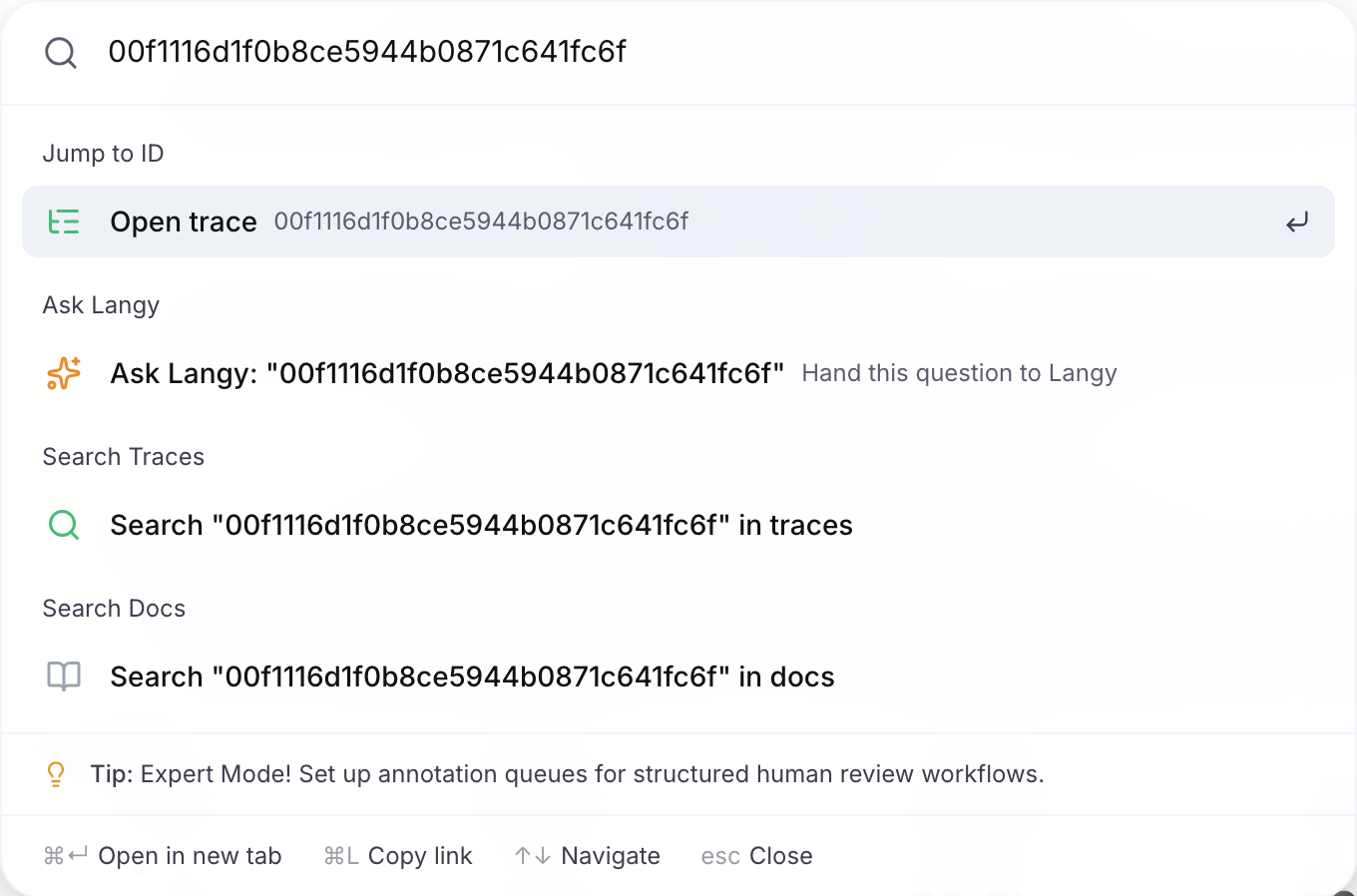 The command bar with a trace id pasted and the Open trace entry under Jump to ID