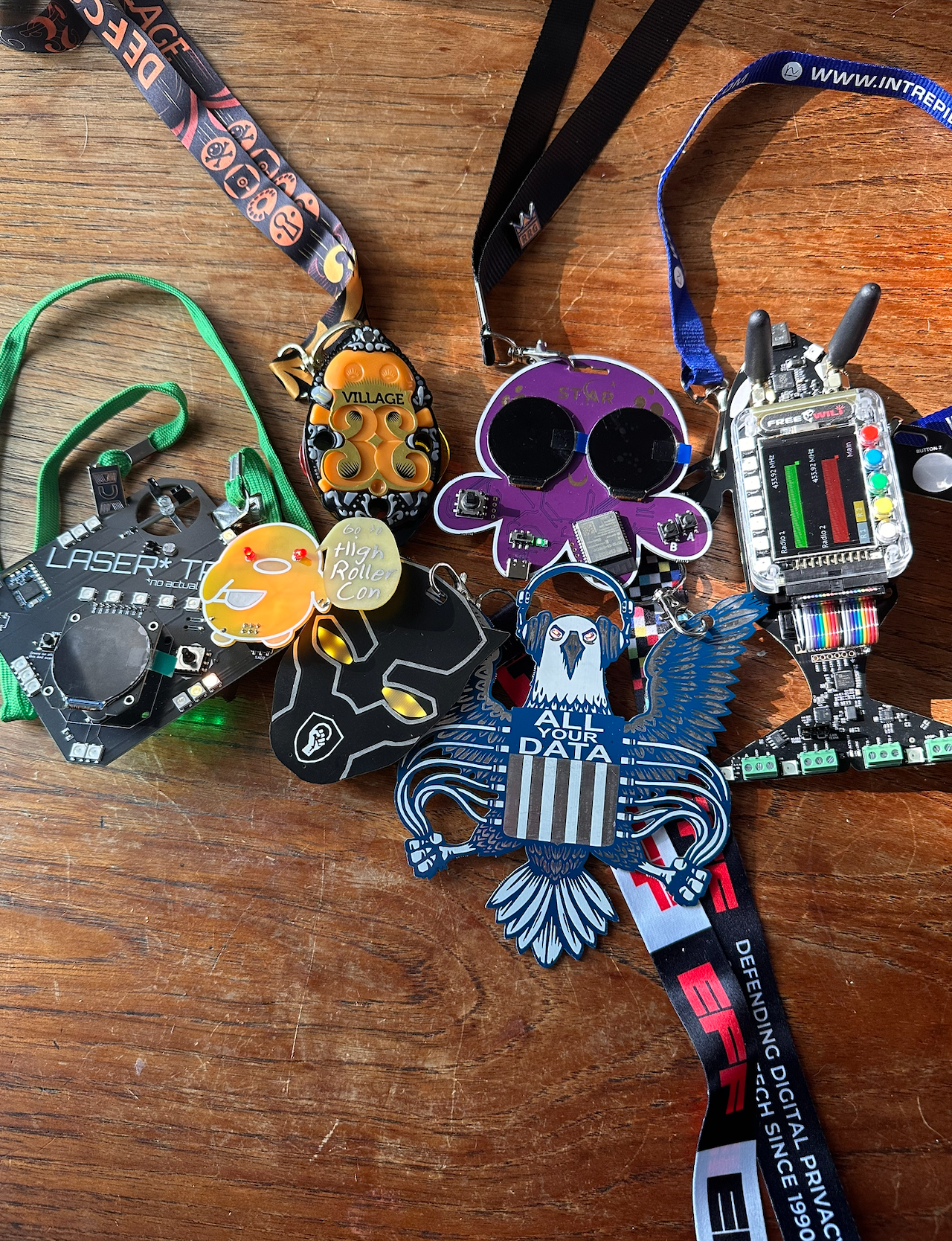 A cool collection of six previous defcon badges.