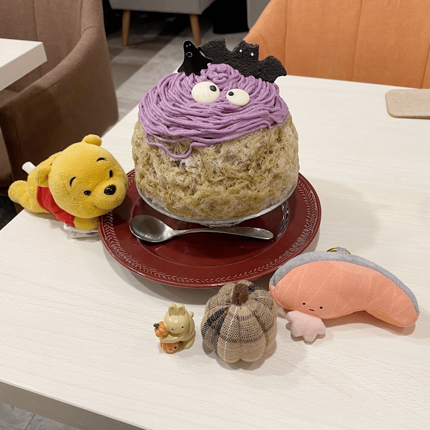 Photo of two shaved ice with Halloween decorations.