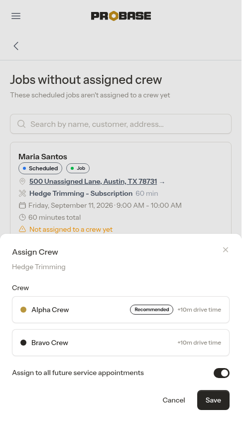 The Assign Crew modal showing a Recommended badge and each crew's drive time