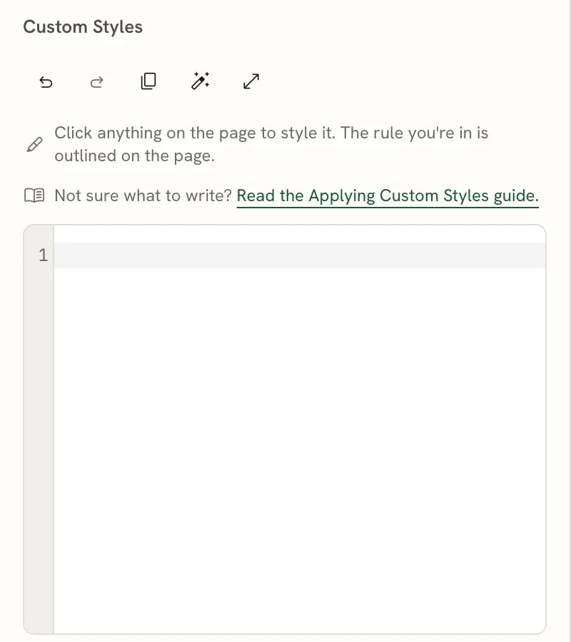 The Custom Styles heading with a toolbar of five icons (undo, redo, copy, format, focus mode), two hint lines, and an empty code editor