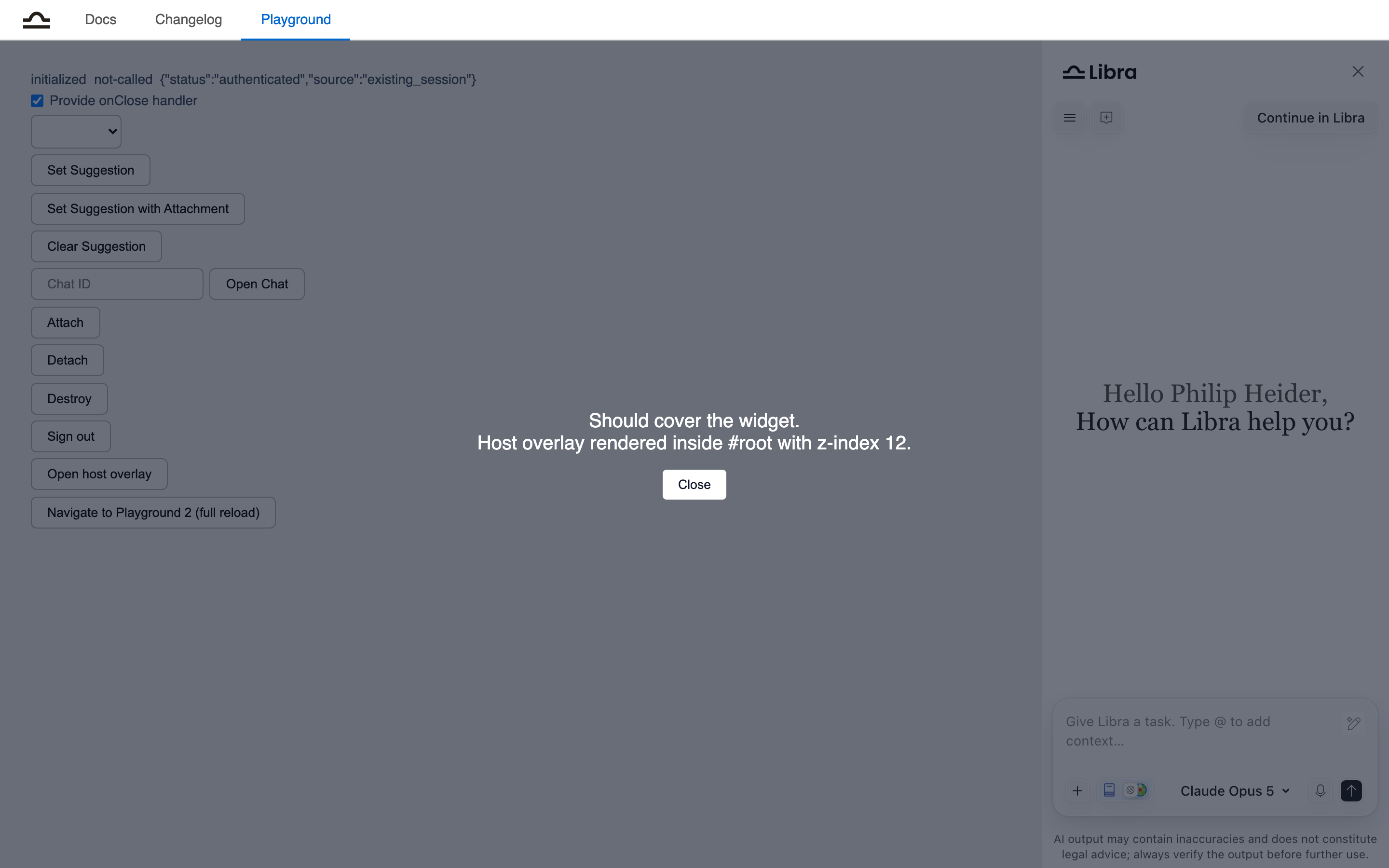 The playground with a dark host overlay covering both the page content and the Libra widget