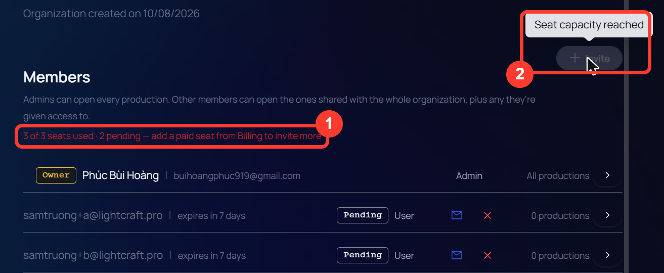 The Members section of Organization Settings. The seat line is red and reads 3 of 3 seats used, 2 pending, add a paid seat from Billing to invite more. The Invite button is greyed out with the tooltip Seat capacity reached. Below are the owner and two pending invitations.