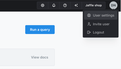 The account menu opened from the user initials in the top-right corner, with User Settings highlighted