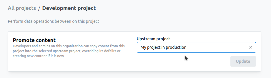 The Data ops tab of the development project's settings, with a picker for the upstream project to promote content into