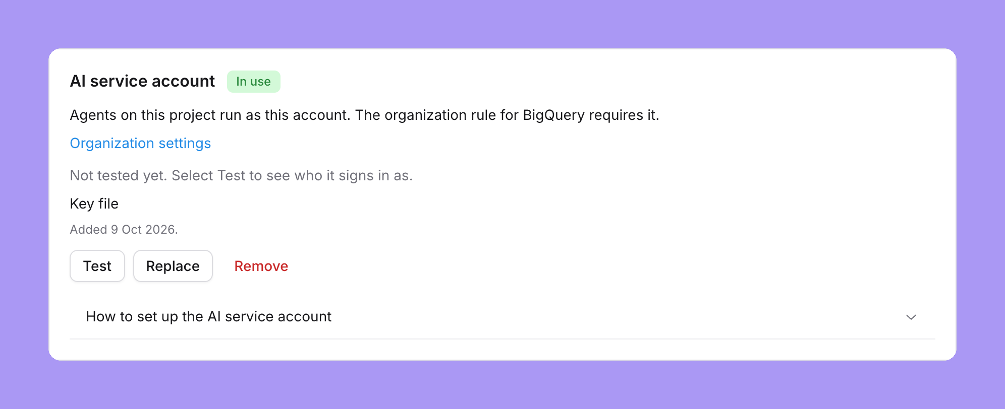 The shared agent account card on a BigQuery project, marked In use: Agents on this project run as this account. The organization rule for BigQuery requires it, an Organization settings link, Not tested yet, Key file, Added 9 Oct 2026 and Test, Replace and Remove buttons