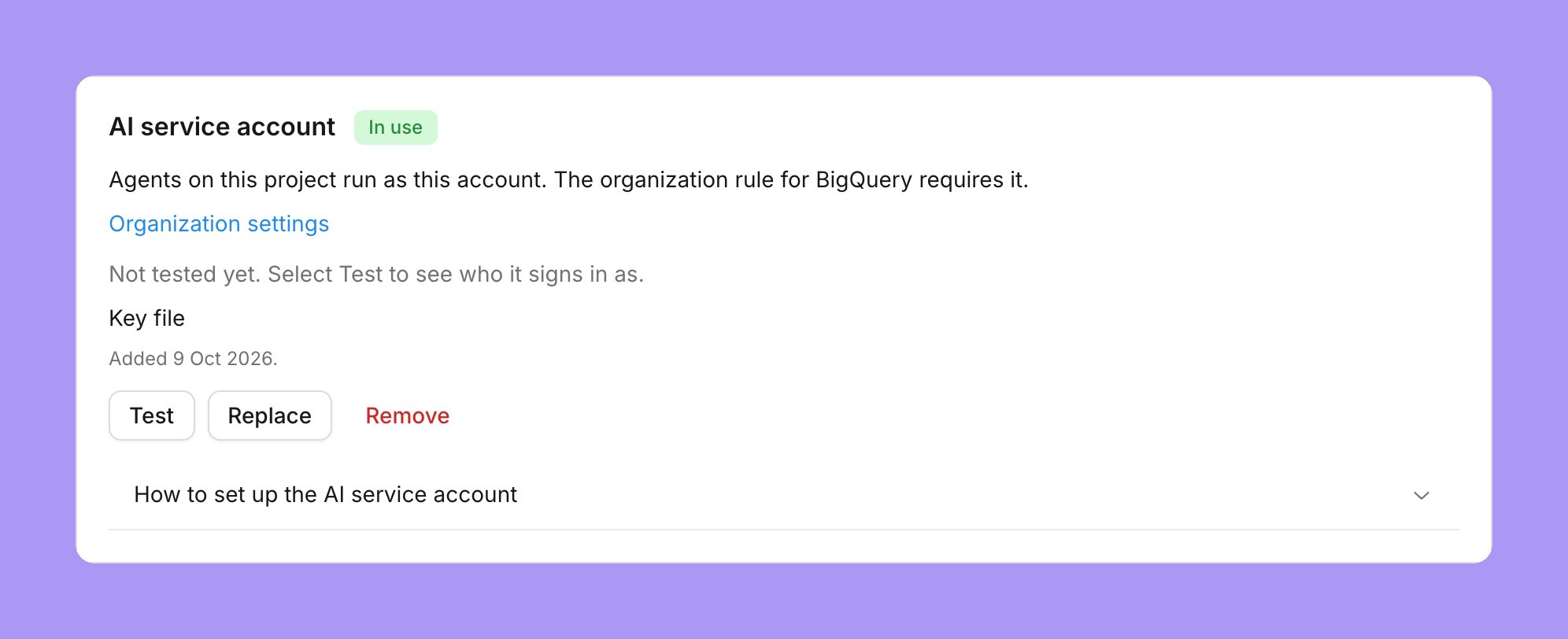 The shared agent account card on a BigQuery project, marked In use: Agents on this project run as this account. The organization rule for BigQuery requires it, an Organization settings link, Not tested yet, Key file, Added 9 Oct 2026 and Test, Replace and Remove buttons