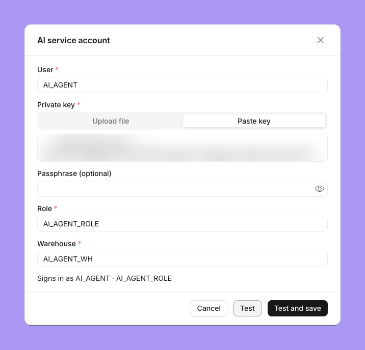 The shared agent account form for Snowflake with User, Private key with Upload file and Paste key options and the key blurred, Passphrase (optional), Role and Warehouse fields, the line Signs in as AI_AGENT · AI_AGENT_ROLE, and Cancel, Test and Test and save buttons