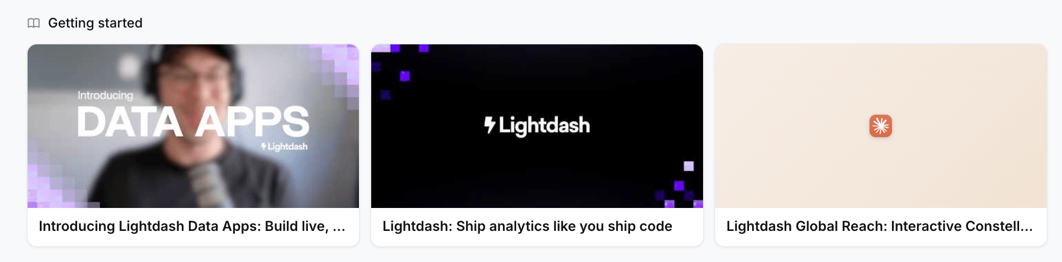 A Getting started Resources block containing a Lightdash Data Apps video, a Lightdash engineering video, and an interactive Claude Artifact