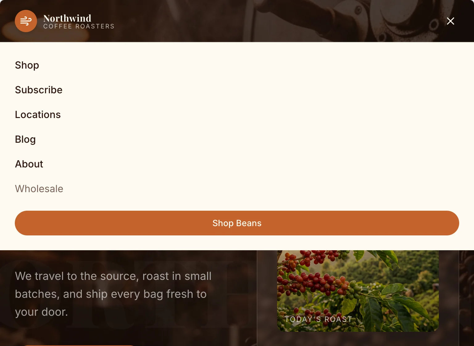 The opened tablet menu listing Shop, Subscribe, Locations, Blog, About and Wholesale, with an orange Shop Beans button