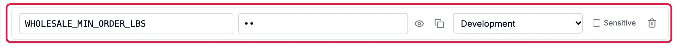 The saved row: WHOLESALE_MIN_ORDER_LBS, its hidden value, Development, outlined