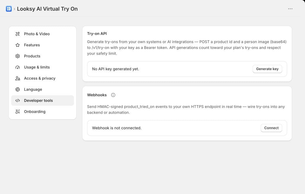 Looksy Developer tools showing the Try-on API key control and Webhooks connection status.