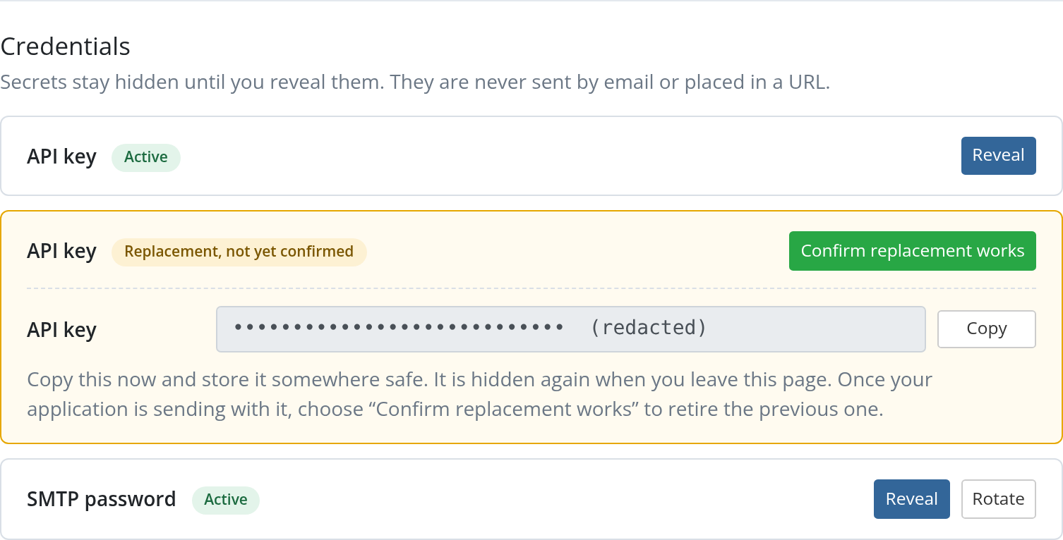 Credentials section during rotation, with the original API key still active and a highlighted replacement awaiting confirmation