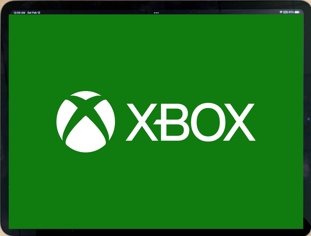 The XBOX logo filling the screen of a landscape tablet