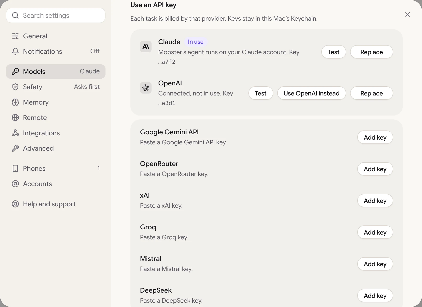 Settings › Models, Use an API key: Claude in use, OpenAI connected but not in use, and the other providers' keys.