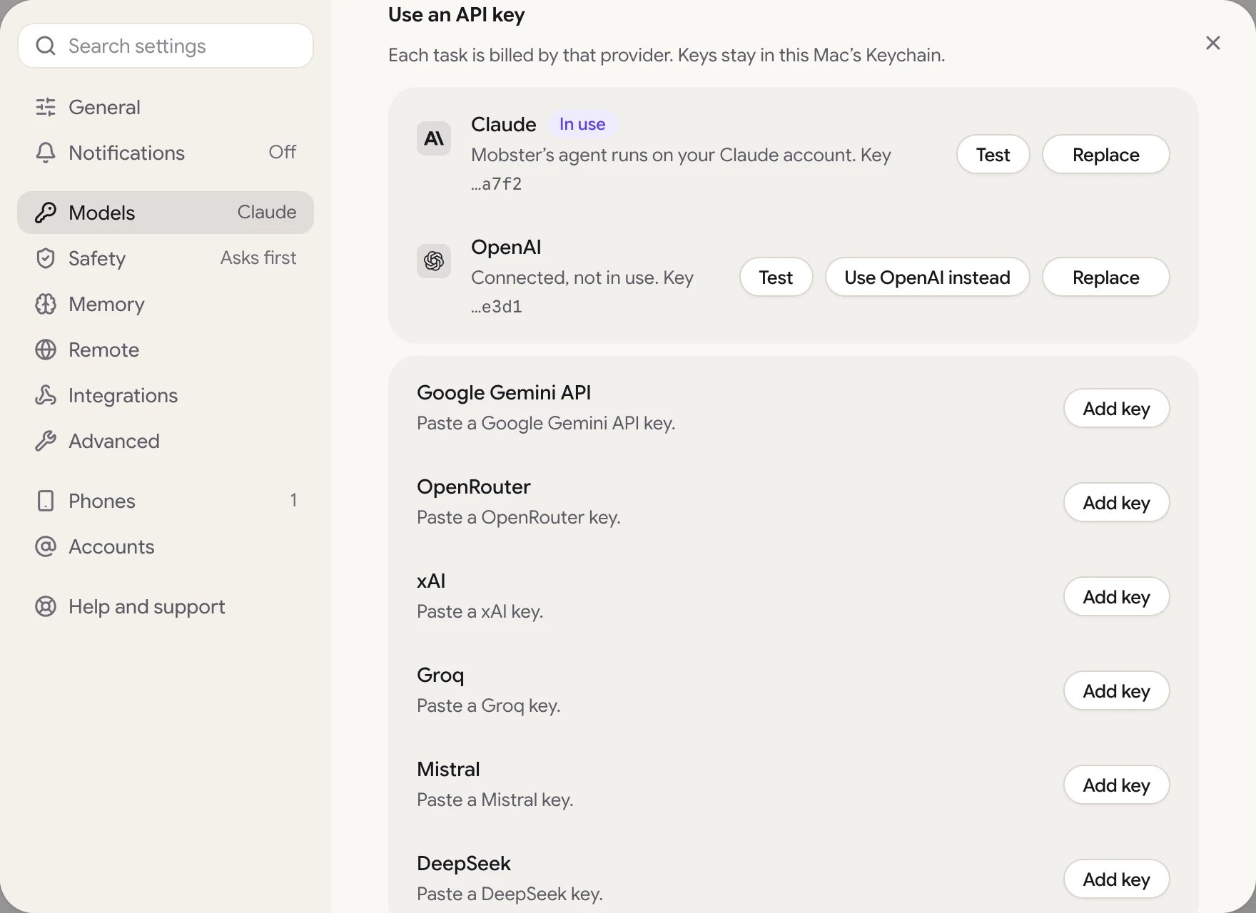 Settings › Models, Use an API key: Claude in use, OpenAI connected but not in use, and the other providers' keys.