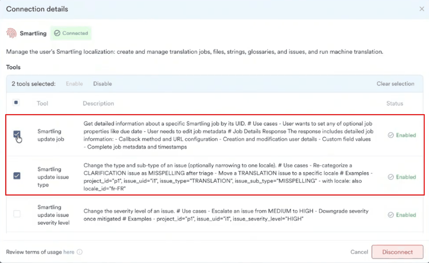 Connection details dialog for a connected Smartling account with two tools selected and the Enable and Disable actions above the table