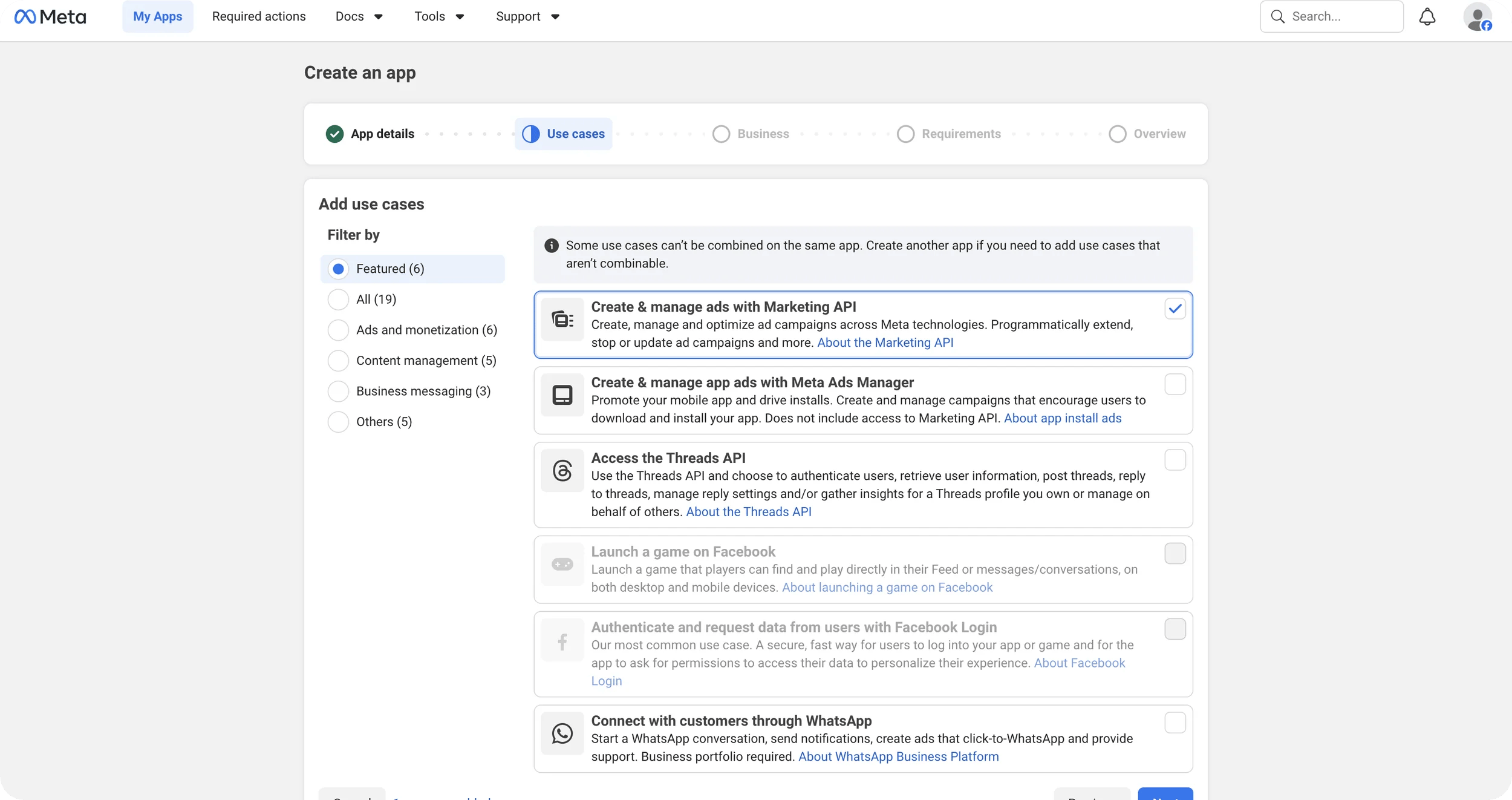 Meta Create an app wizard with the Use cases step showing Create and manage ads with Marketing API selected