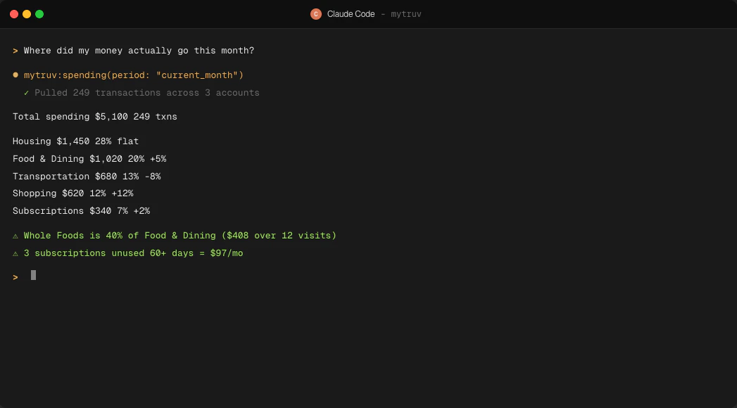Claude Code session calling mytruv:spending and rendering a categorized monthly breakdown in the terminal