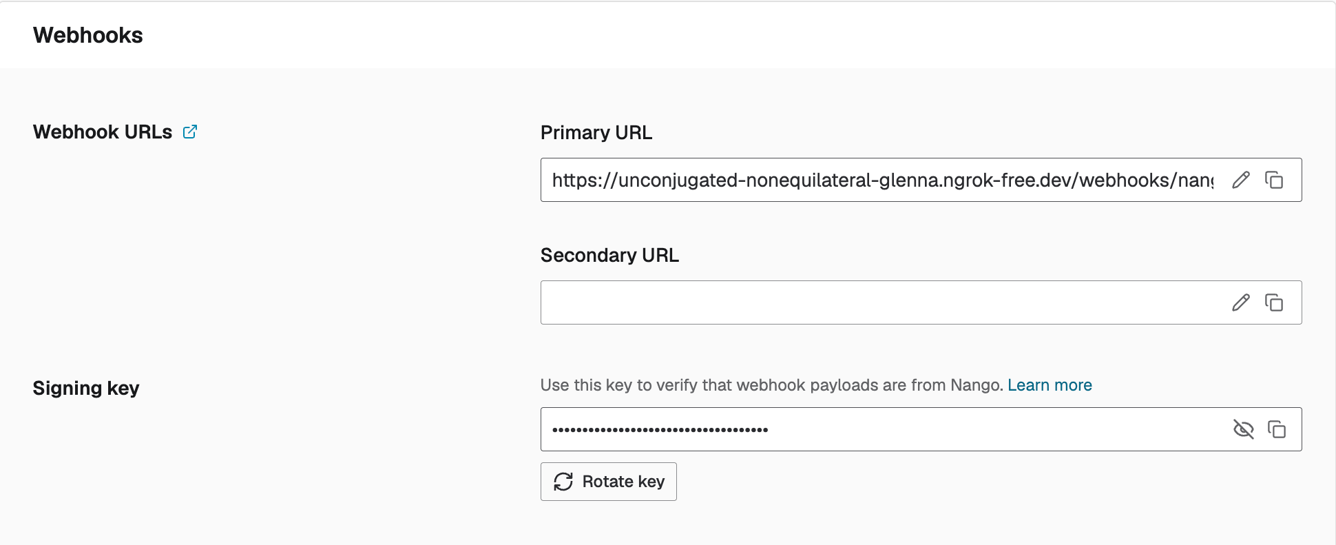 Rotate key button under Environment Settings > Webhooks