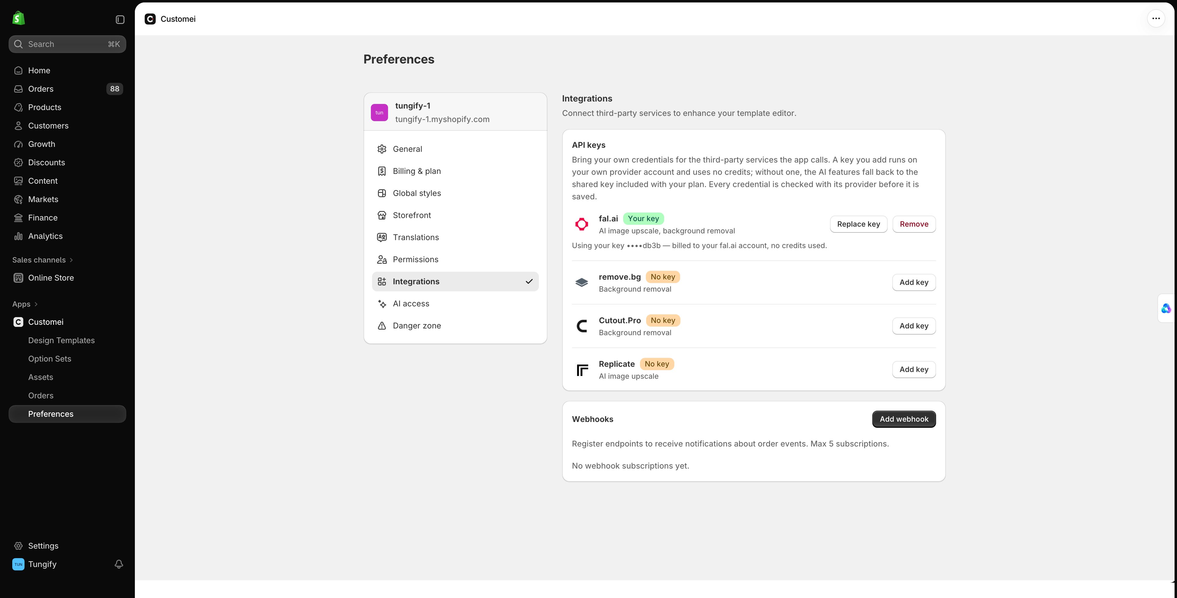 The Integrations tab in Customei preferences showing an API keys card listing fal.ai, remove.bg, Cutout.Pro and Replicate, and a Webhooks card below it.