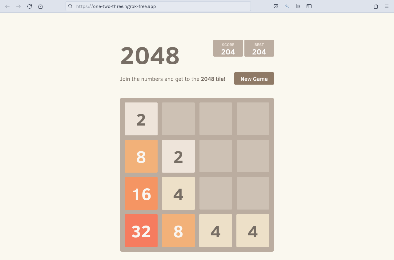 "Navigating directly to the https://one-two-three.ngrok.app domain to see the tinyllama application (note: screenshot shows earlier 2048 app)"