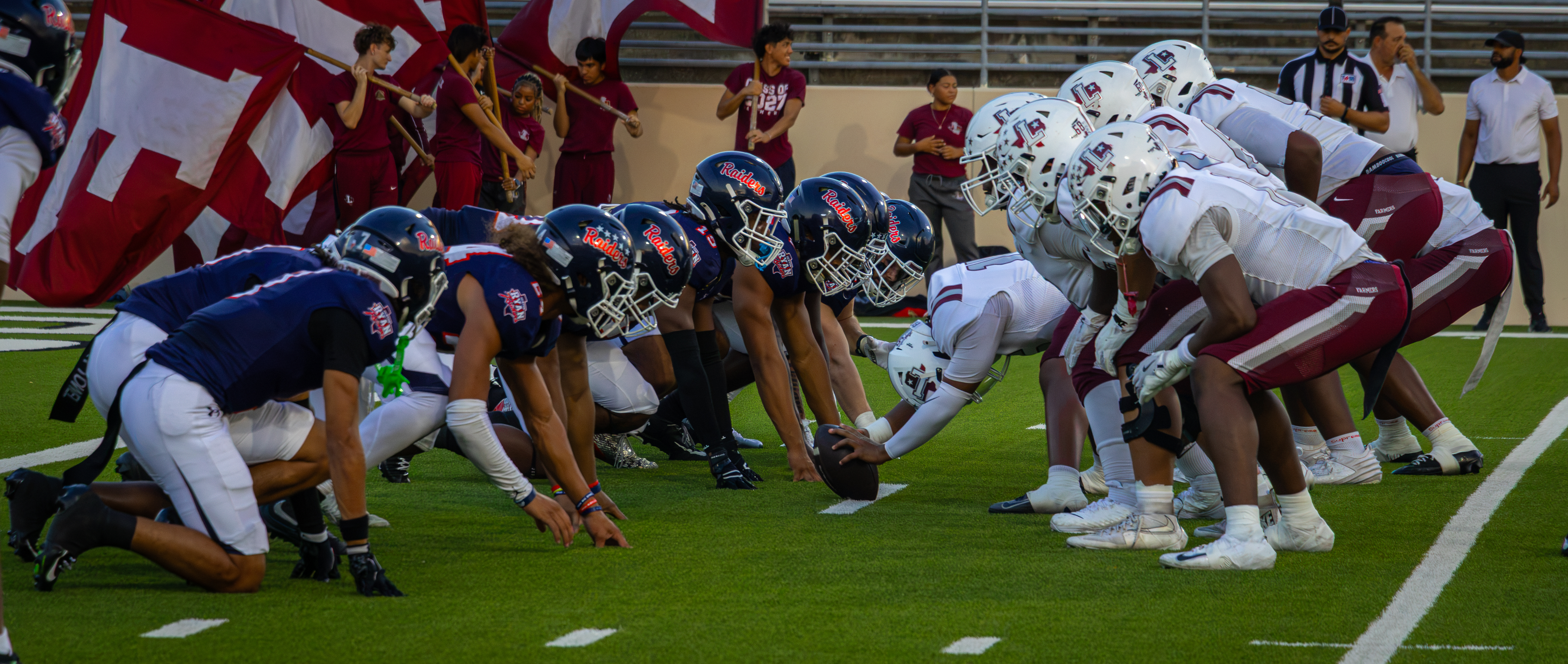 North Texas high school football teams lined up at the line of scrimmage