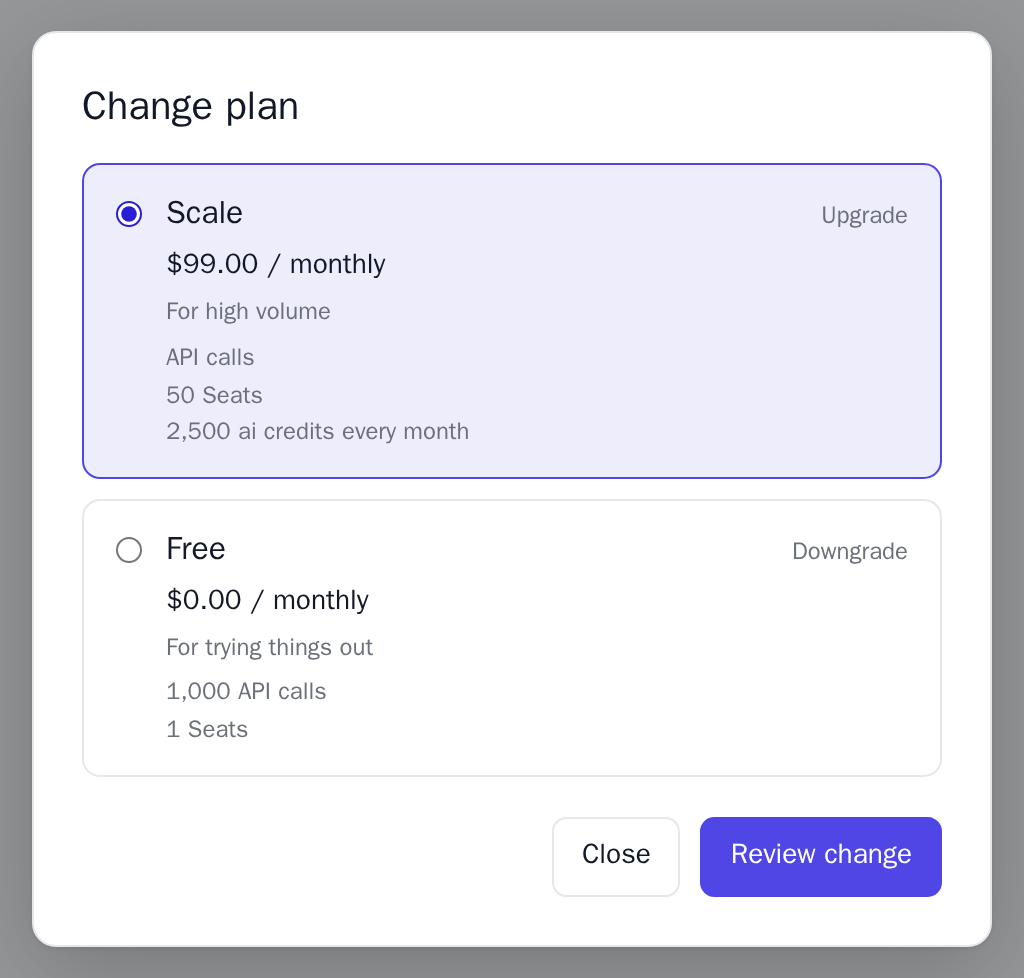 The Change plan dialog with Scale selected as an upgrade and Free as a downgrade, each with its price and lines, light theme