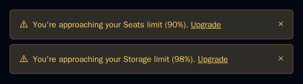 Two UsageAlert warnings for seats at 90% and storage at 98%, dark theme