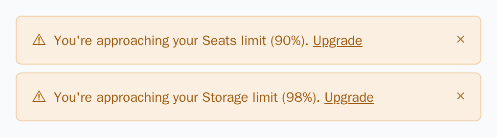 Two UsageAlert warnings for seats at 90% and storage at 98%, light theme