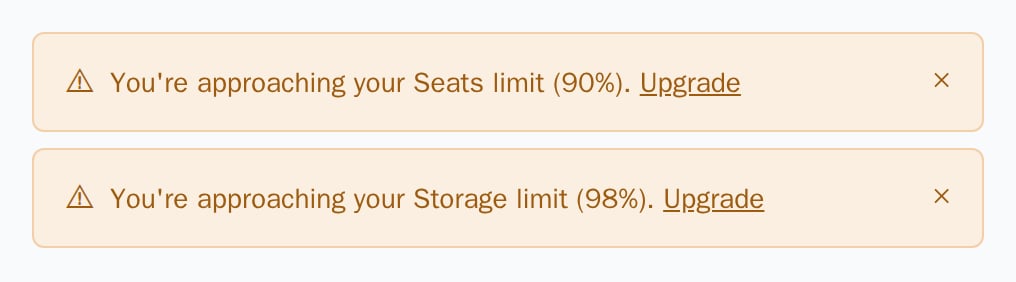 Two UsageAlert warnings for seats at 90% and storage at 98%, light theme