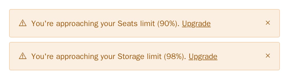 Two UsageAlert warnings for seats at 90% and storage at 98%, minimal theme