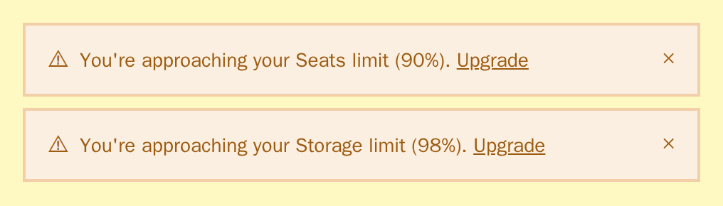Two UsageAlert warnings for seats at 90% and storage at 98%, neobrutal theme