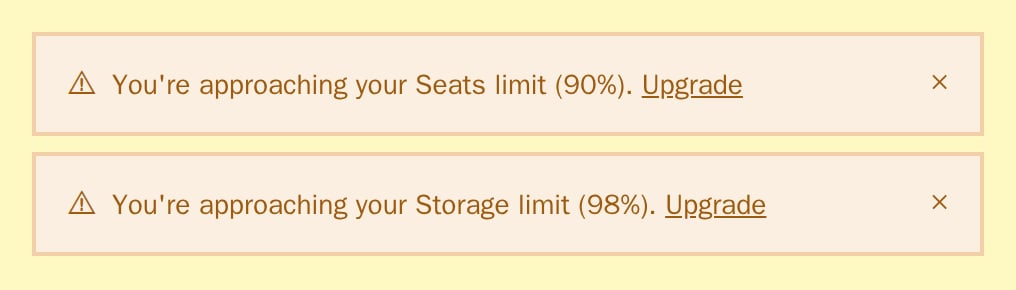 Two UsageAlert warnings for seats at 90% and storage at 98%, neobrutal theme