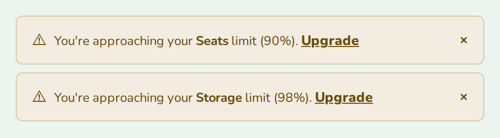 Two UsageAlert warnings for seats at 90% and storage at 98%, nozle theme