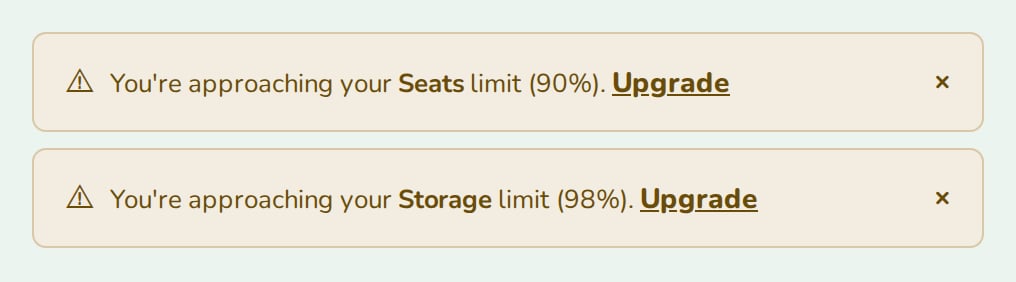 Two UsageAlert warnings for seats at 90% and storage at 98%, nozle theme