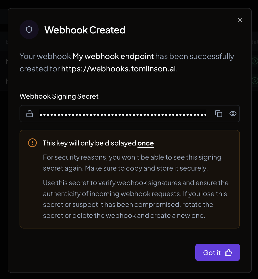 The confirmation dialog showing the newly created webhook signing secret
