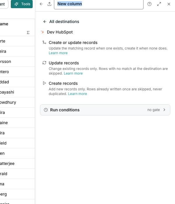 The export editor docked beside a table, showing the chosen destination and its create or update action at the top, a What to write card with contacts as the destination object, a Match records on card offering hs_object_id and email, and a Destination fields card whose rows each carry a Map button. A red line below asks for at least one match field, and Create is greyed out.