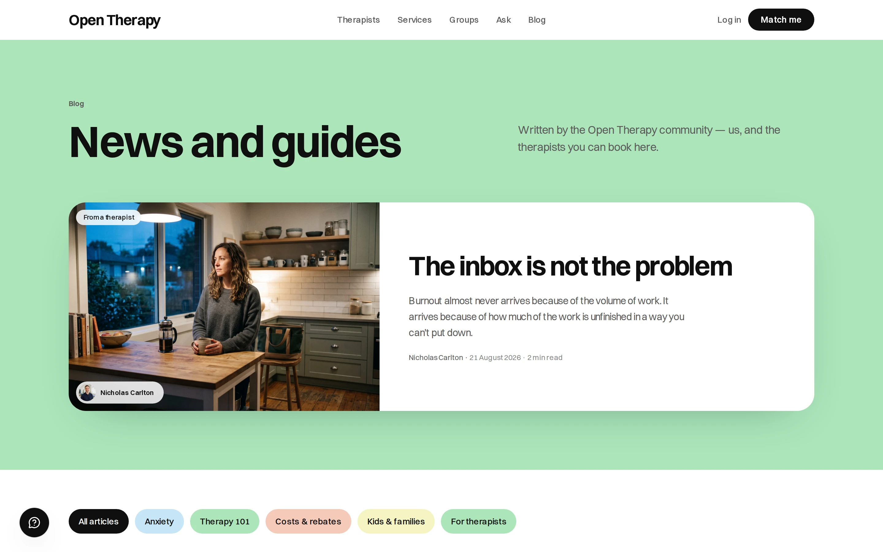 The public Open Therapy blog headed News and guides, with a line saying it is written by the Open Therapy community and the therapists you can book here, and a lead article titled The inbox is not the problem, bylined Nicholas Carlton, dated 21 August 2026, with a two-minute read time