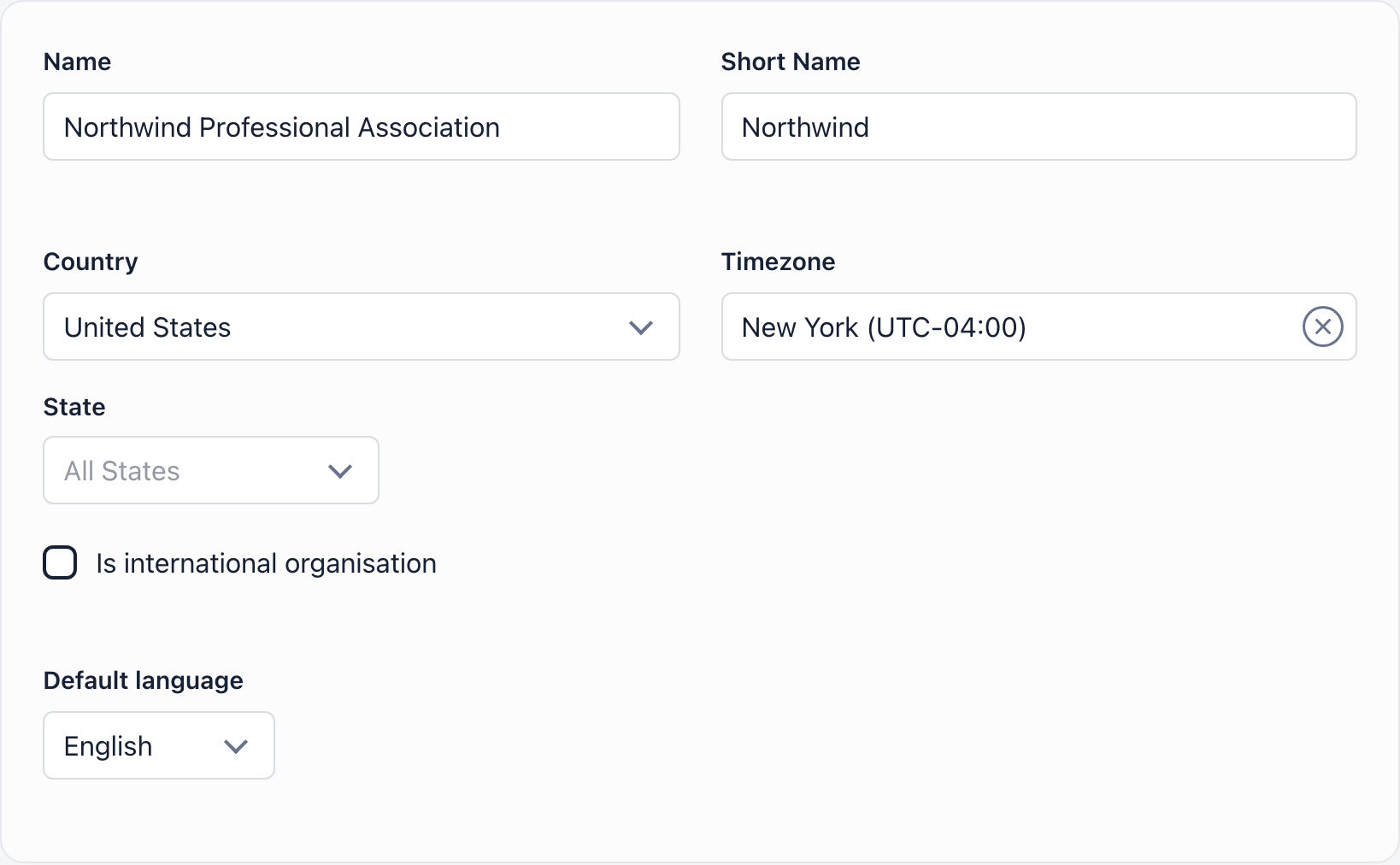 Basic details card with organization name, short name, country, timezone, international organisation checkbox and default language