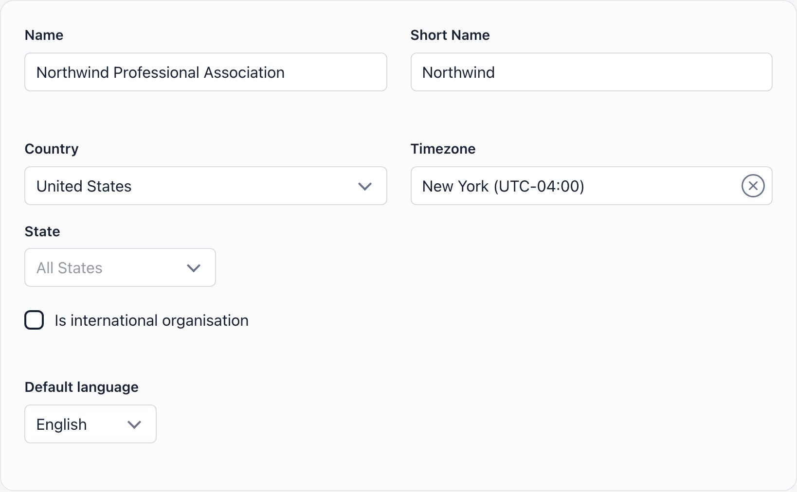 Basic details card with organization name, short name, country, timezone, international organisation checkbox and default language