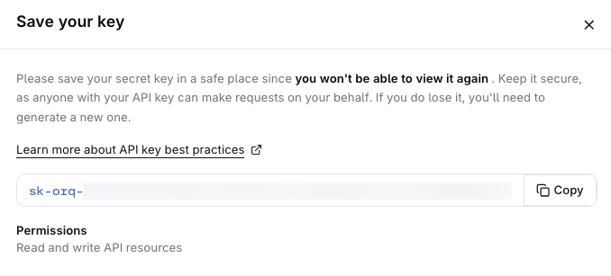 Save your key dialog showing the API key token with a Copy button and a Permissions summary reading Read and write API resources.