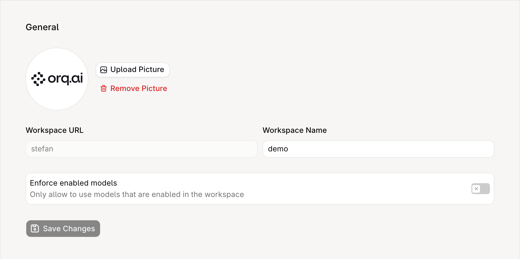 General Settings page showing the workspace avatar with Upload Picture and Remove Picture buttons, the read-only Workspace URL field, the Workspace Name field, the Enforce enabled models toggle, and the Save Changes button.