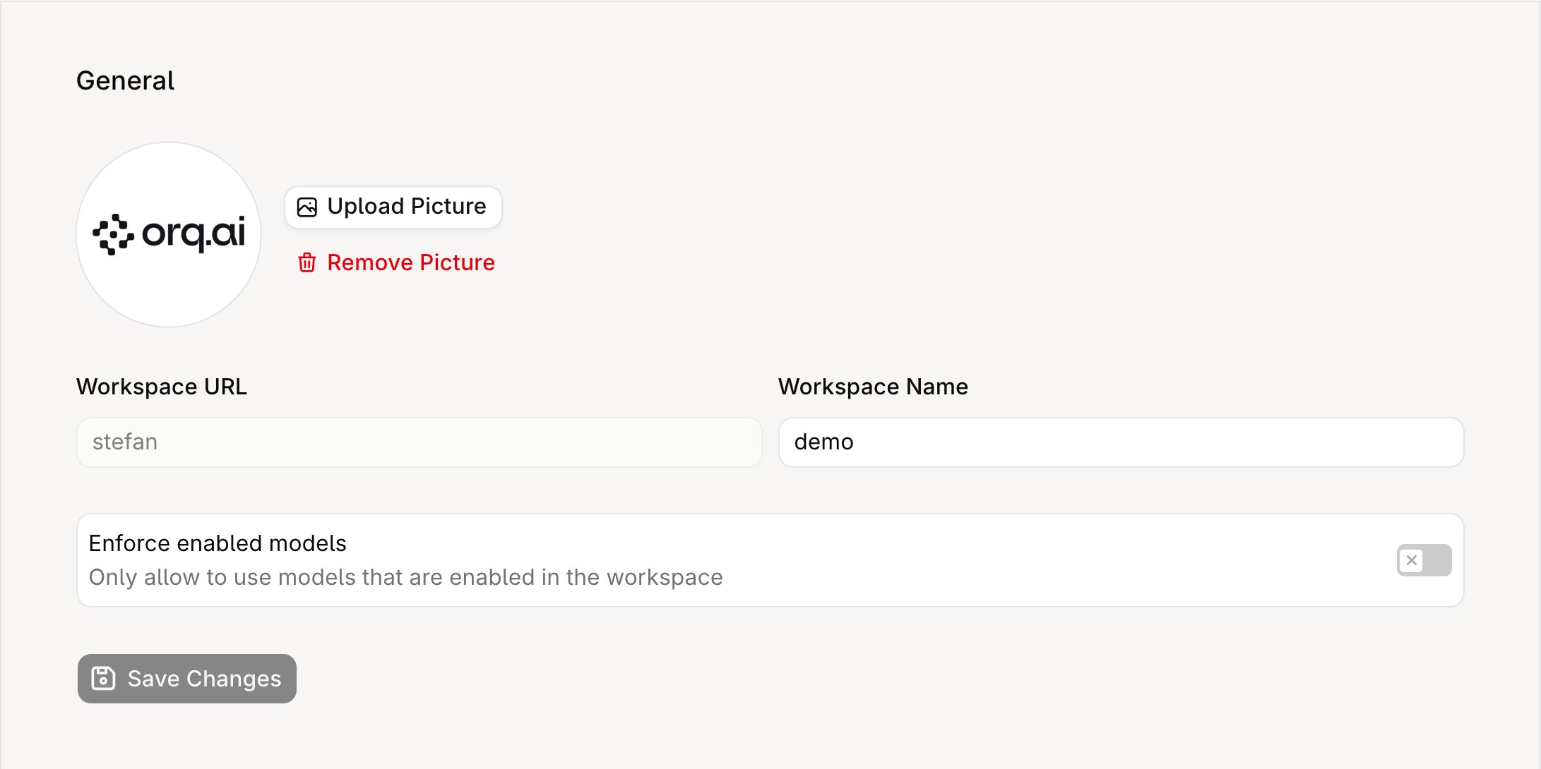 General Settings page showing the workspace avatar with Upload Picture and Remove Picture buttons, the read-only Workspace URL field, the Workspace Name field, the Enforce enabled models toggle, and the Save Changes button.